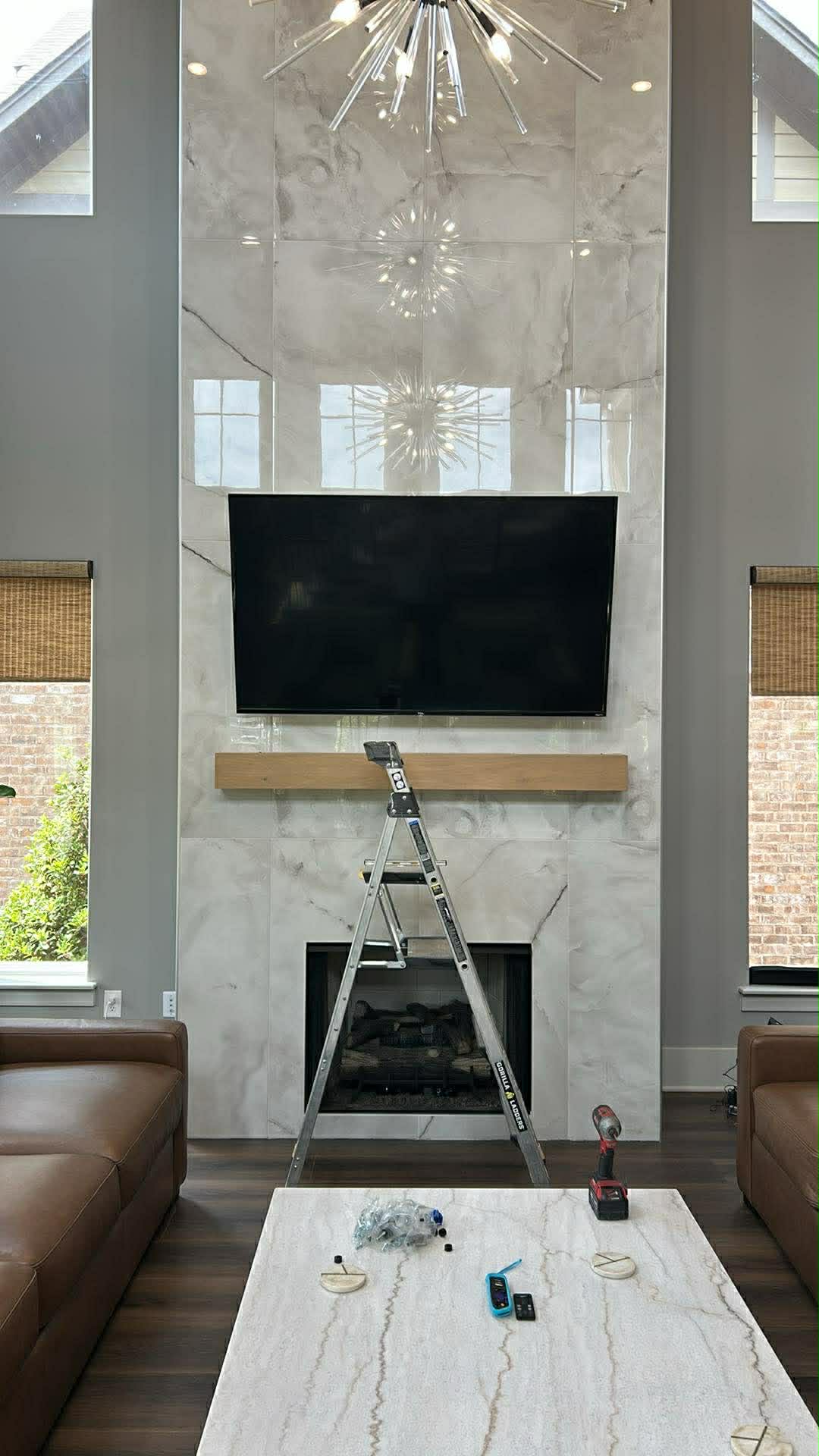 Wall-mounted flat-screen TV with clean cable management in a living room.
